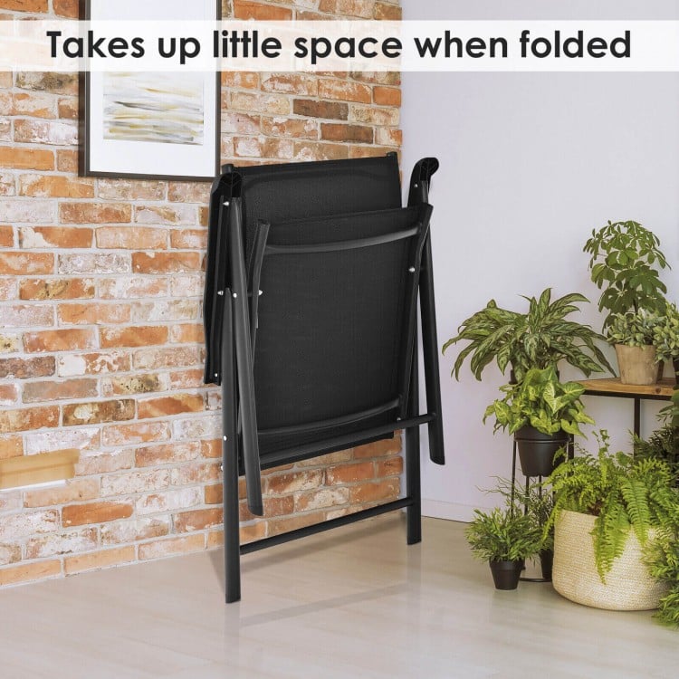Black folding patio chair set with ergonomic armrests, space-saving design, suitable for indoor and outdoor use.